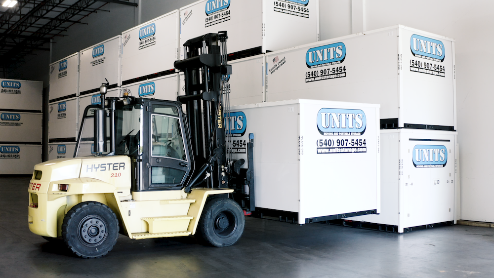 portable storage warehouse facility with forklift moving containers