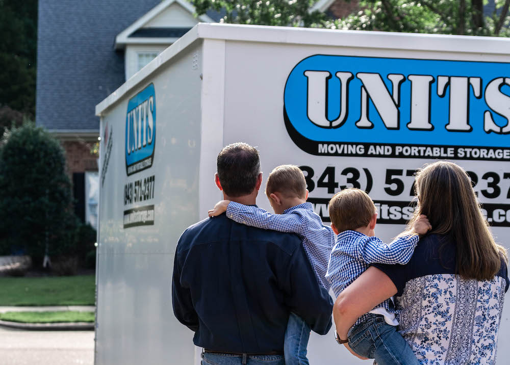 image of a family standing in front of a portable storage container from UNITS