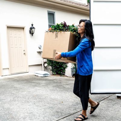 woman unpacking a portable storage container